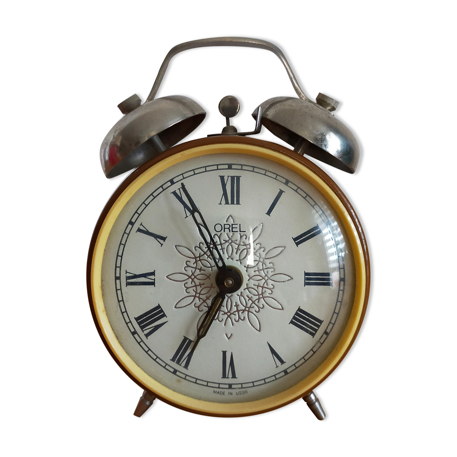 Vintage brown and silver mechanical alarm clock