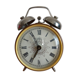 Vintage brown and silver mechanical alarm clock