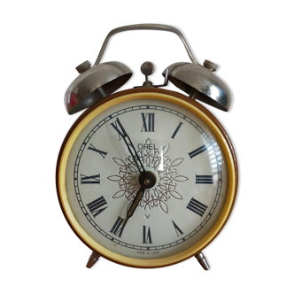 Vintage brown and silver mechanical alarm clock