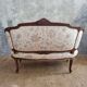 Small sofa or bench in Louis XV style, rococo.