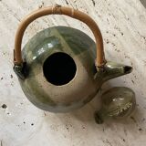 Handmade ceramic teapot with green fish and bamboo