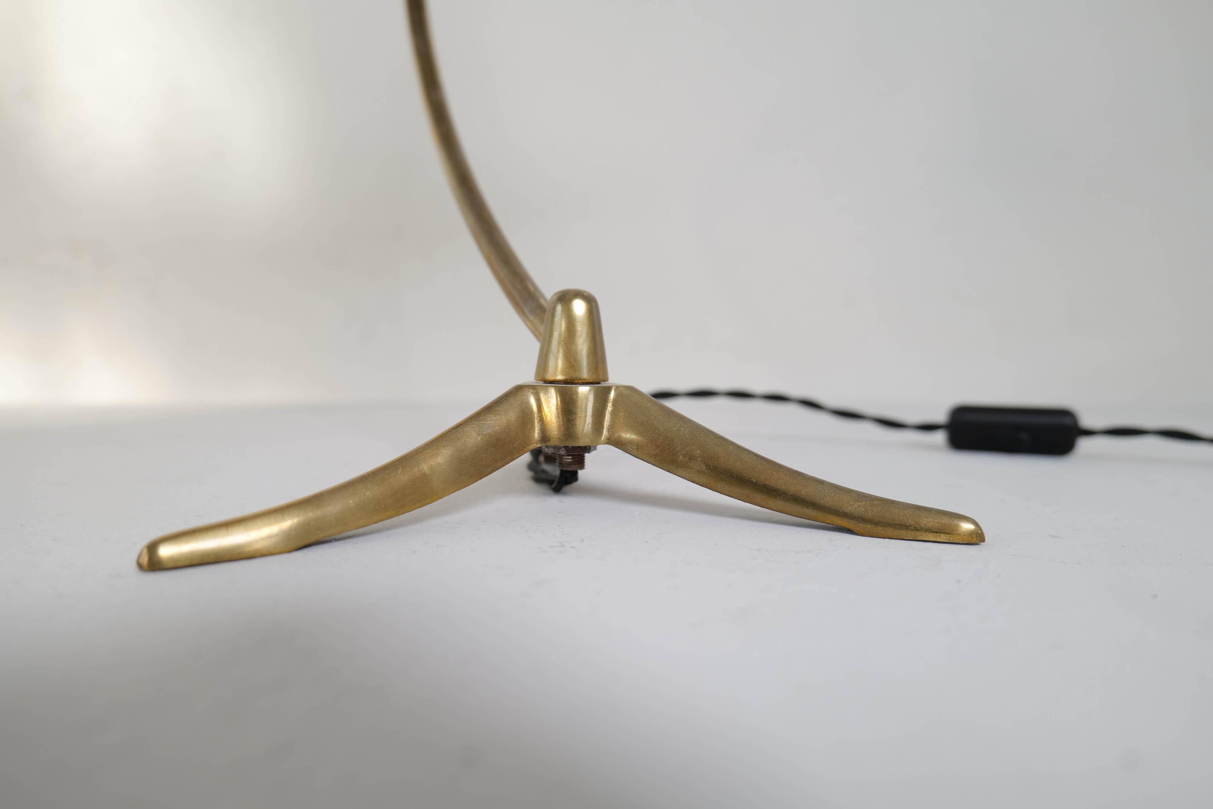 Brass table lamp on a tripod in modern Swedish style, Sweden, 1950.