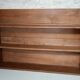 Old wall shelf in raw wood