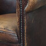 Sheep leather club chair finished with decorative nails