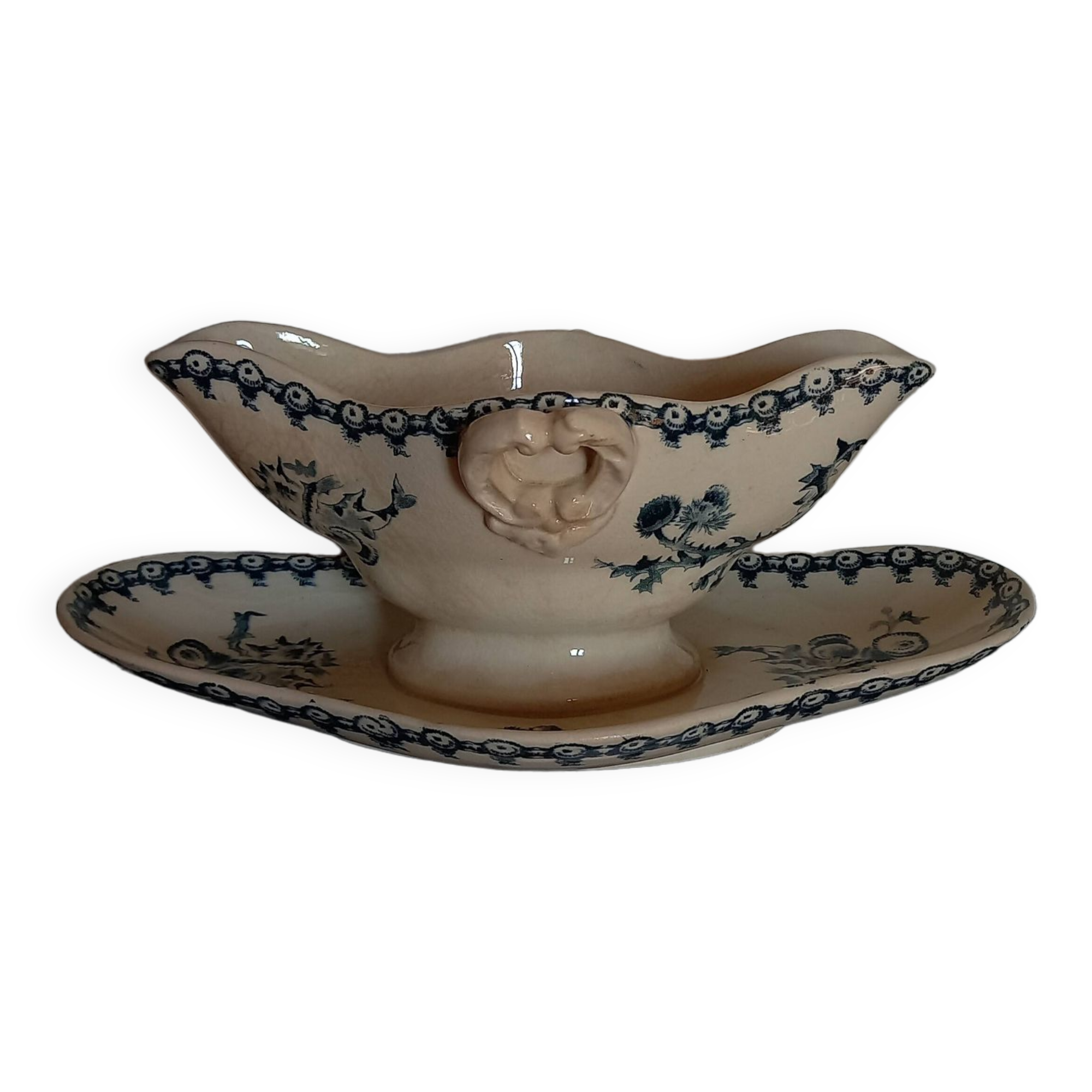 Old gravy boat on frame in terre de fer earthenware by gien, “chardons” model in blue-green