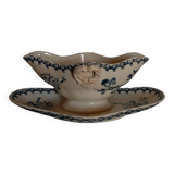 Old gravy boat on frame in terre de fer earthenware by gien, “chardons” model in blue-green