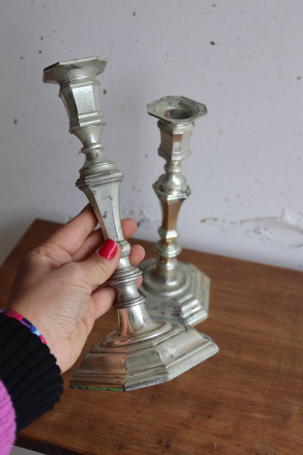 Pair of antique silver-plated metal candlesticks