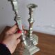 Pair of antique silver-plated metal candlesticks
