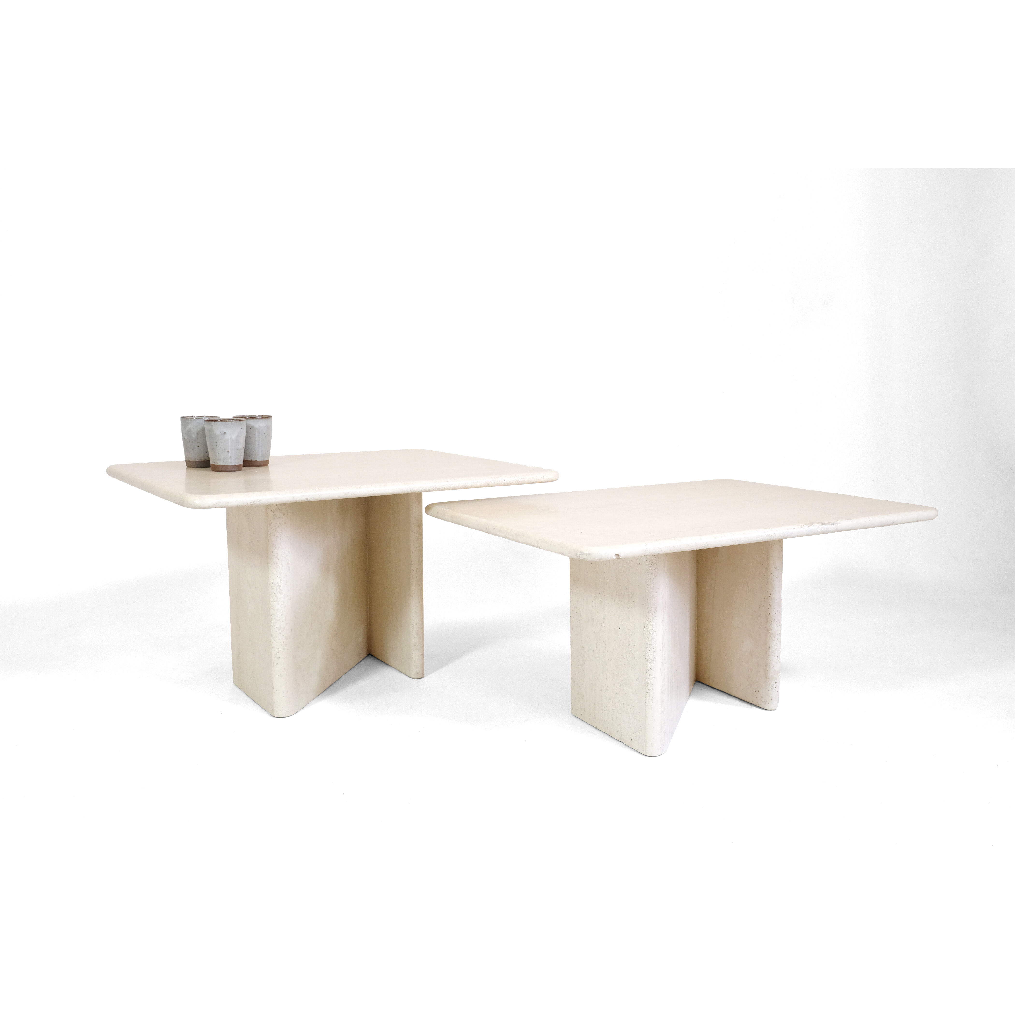 Pair of travertine trundle tables, Italy