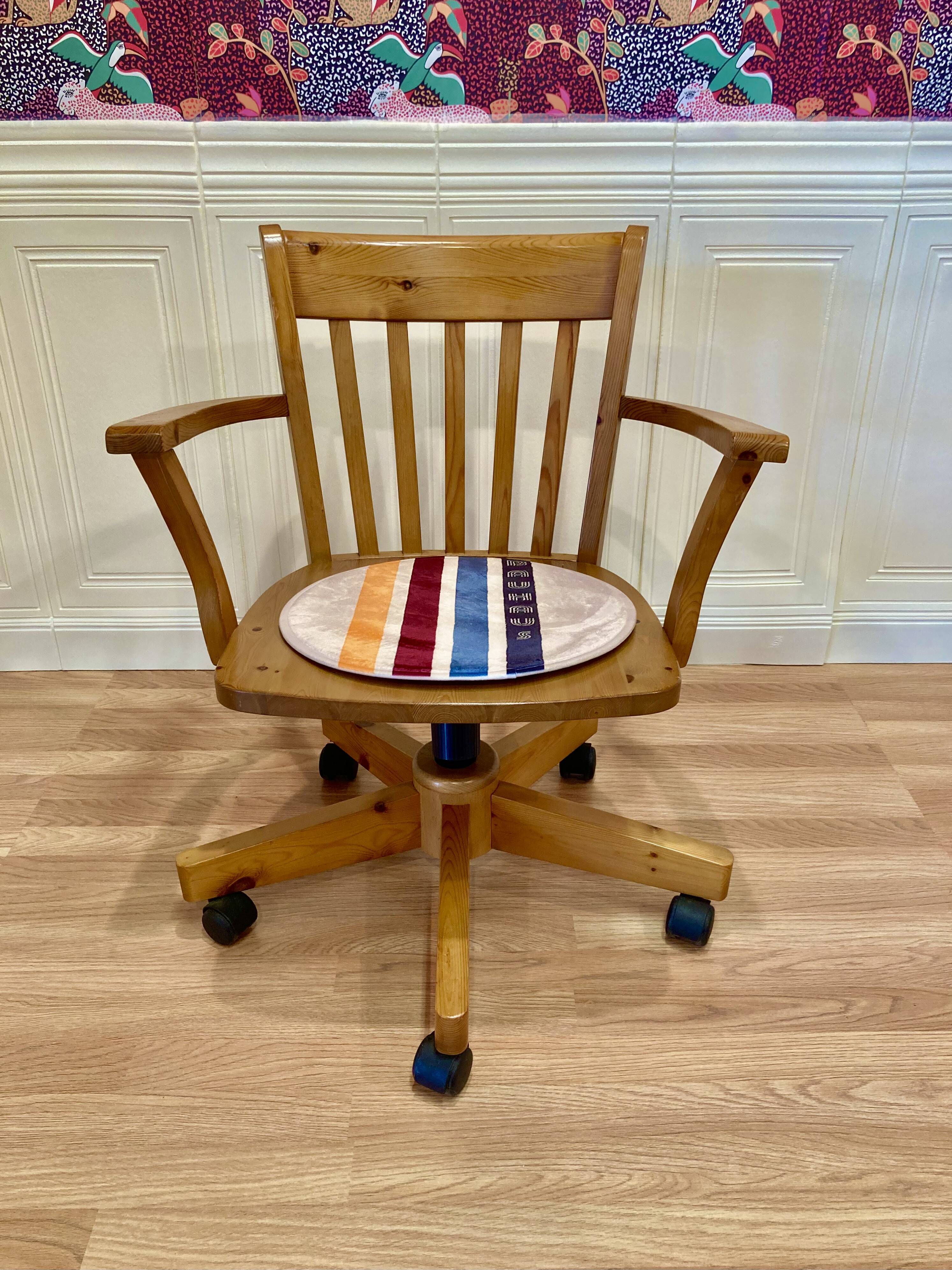 Solid wood swivel and reclining armchair.