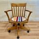 Solid wood swivel and reclining armchair.