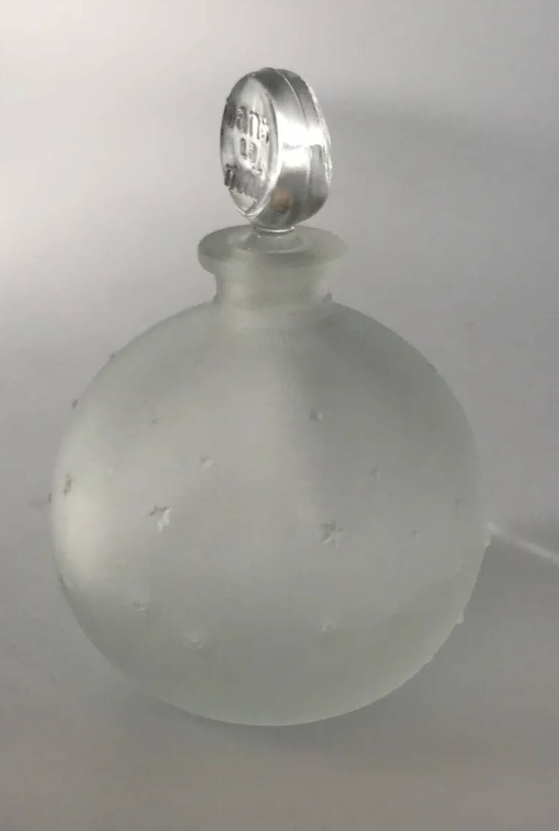 Lalique bottle in the night, frosted glass, ball shape