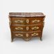 Louis XV period commode with violet wood veneer.