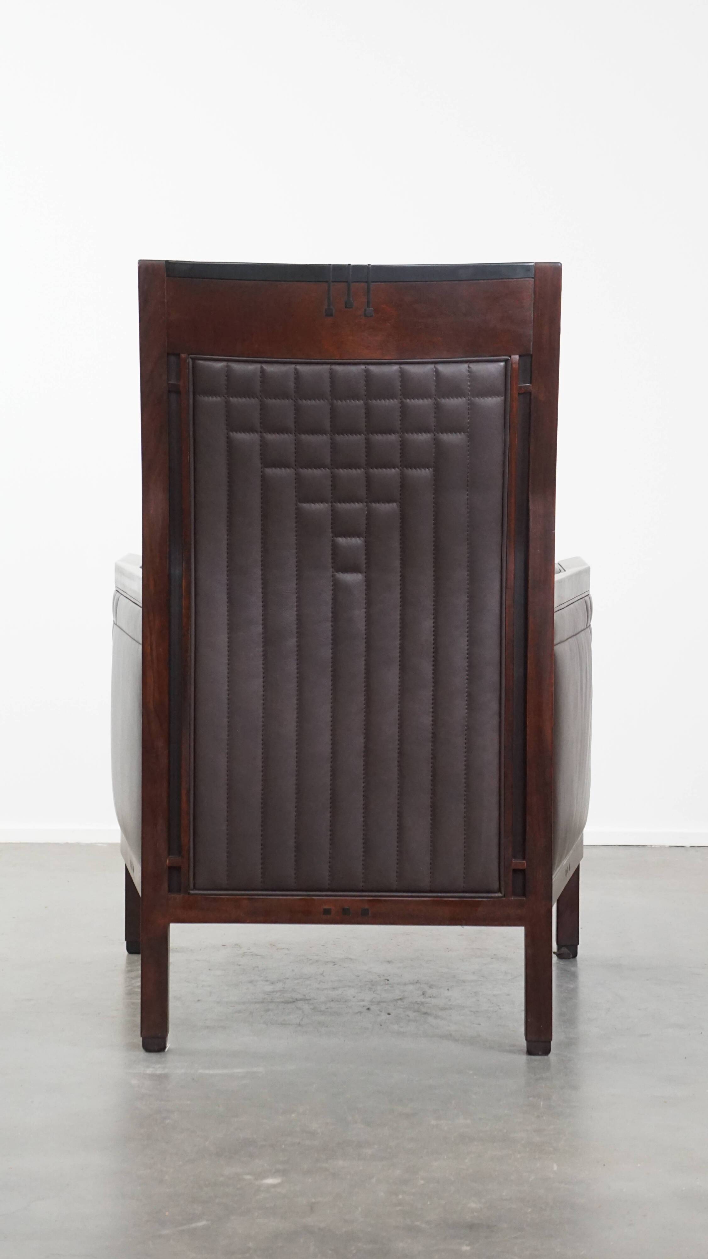 Art Deco armchair with dark brown leather