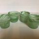 Four green glass paste candle holders