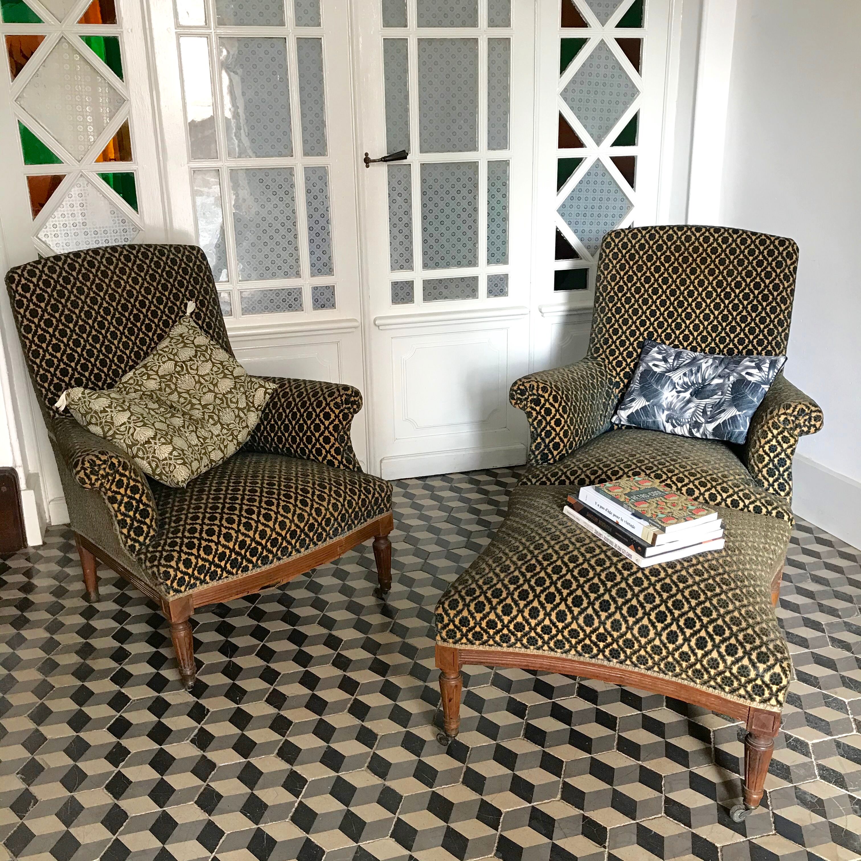 Vintage armchairs and rests feet