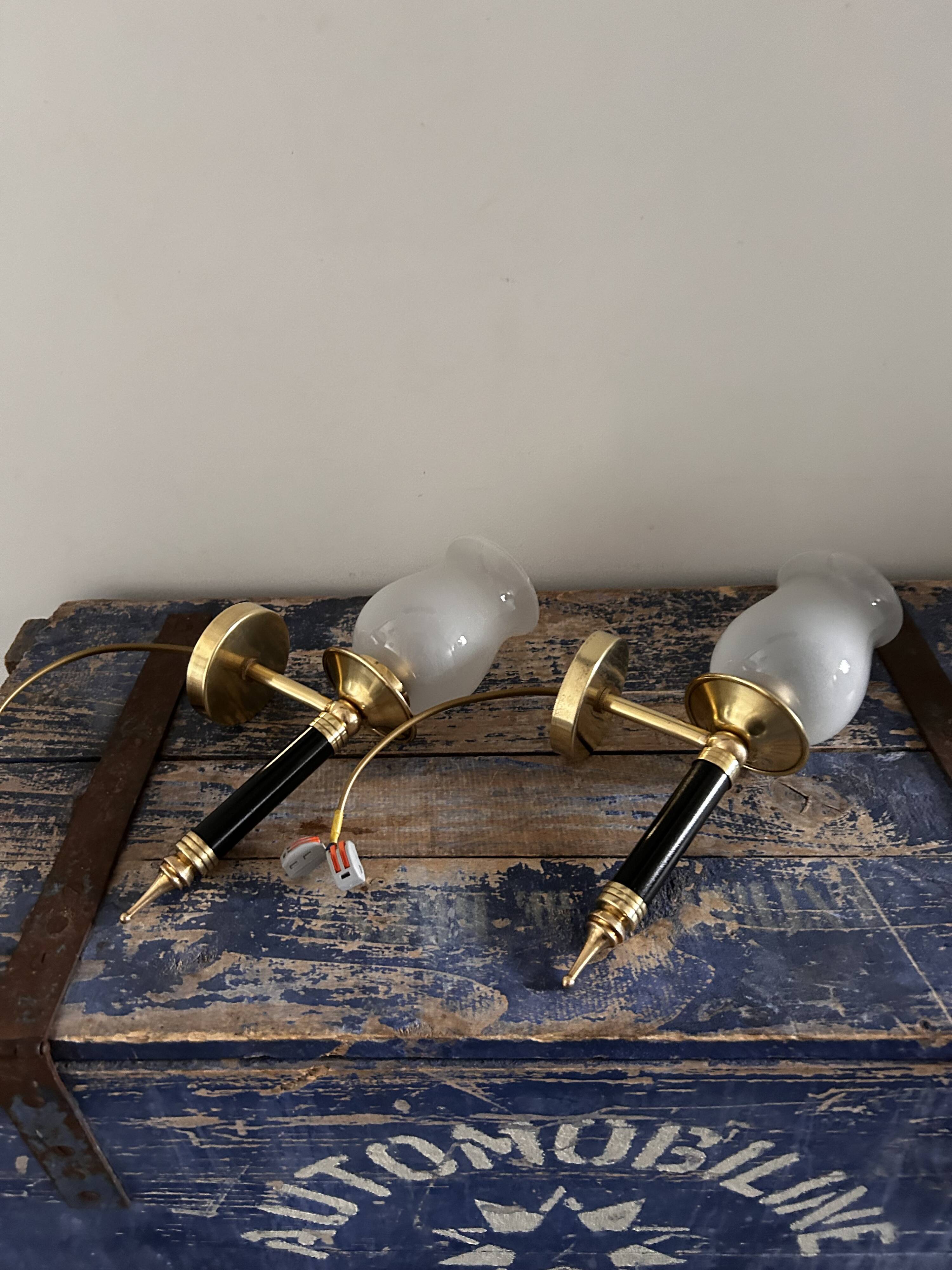 Pair of brass and black torchiere wall lights