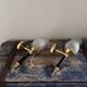 Pair of brass and black torchiere wall lights