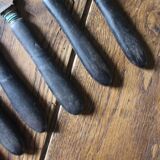A set of 10 small knives with black wooden handles