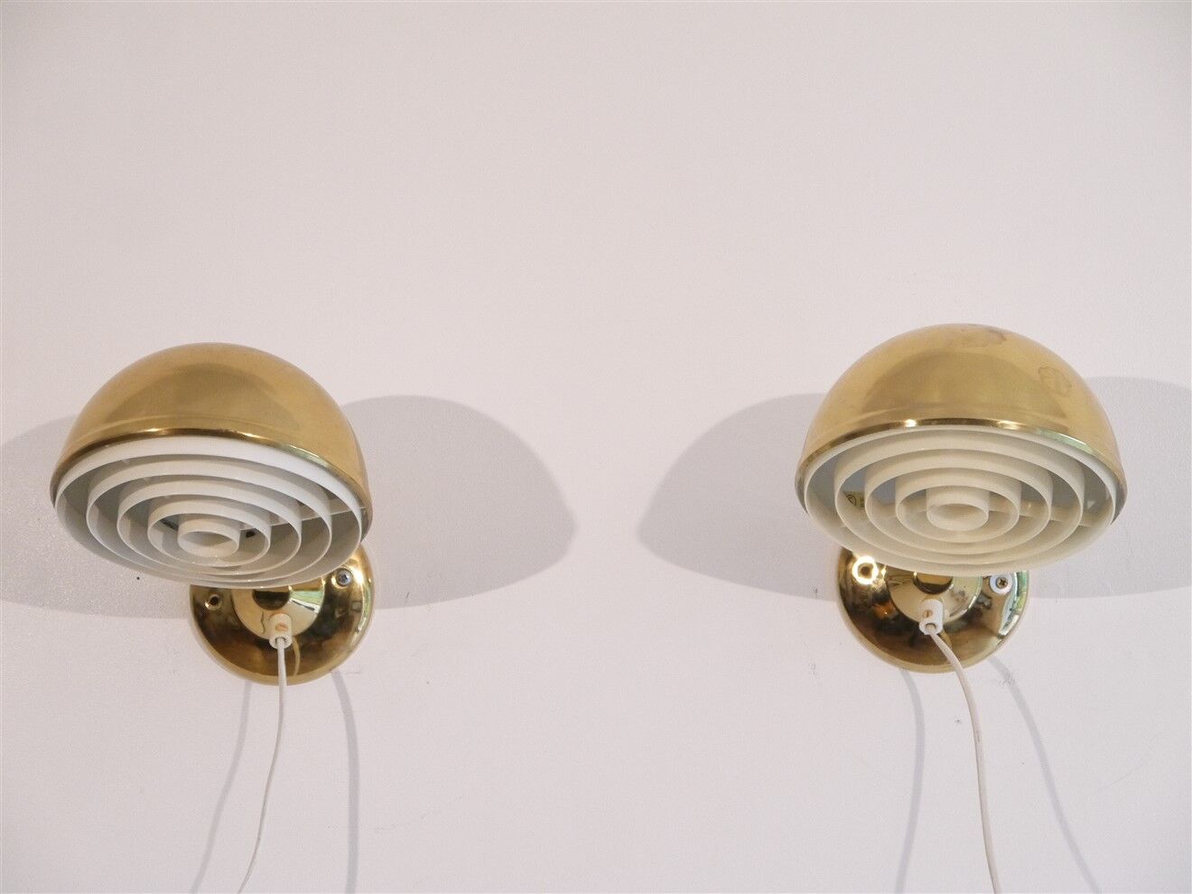 Pair of Danish brass wall lamps by Knud Christensen 1970