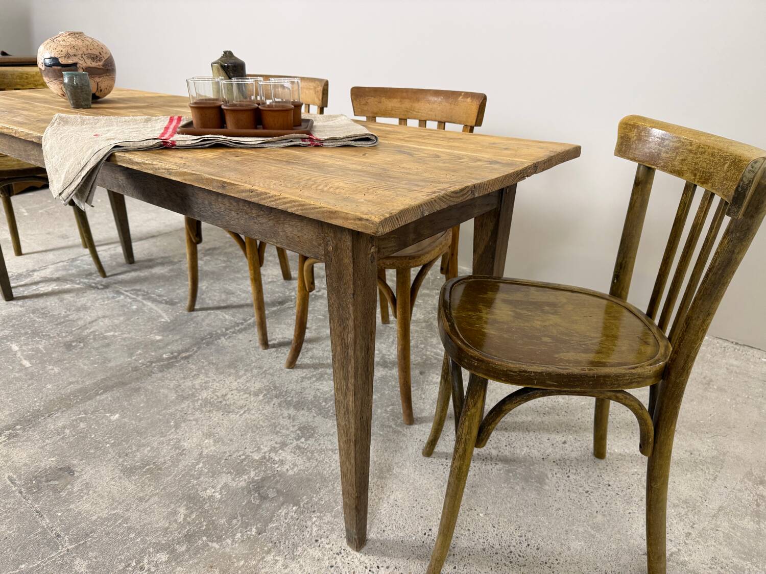 Old farmhouse table with tapered legs, late 19th to early 20th century.