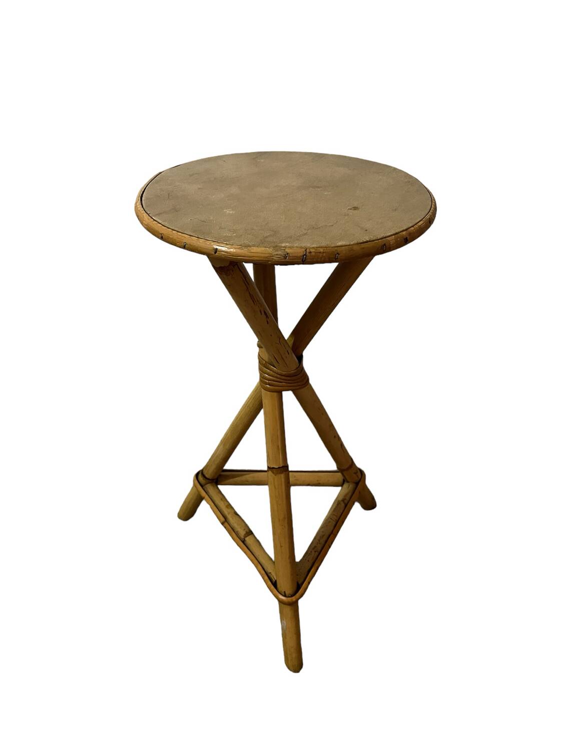 Plant holder or side table at the end of a bamboo sofa