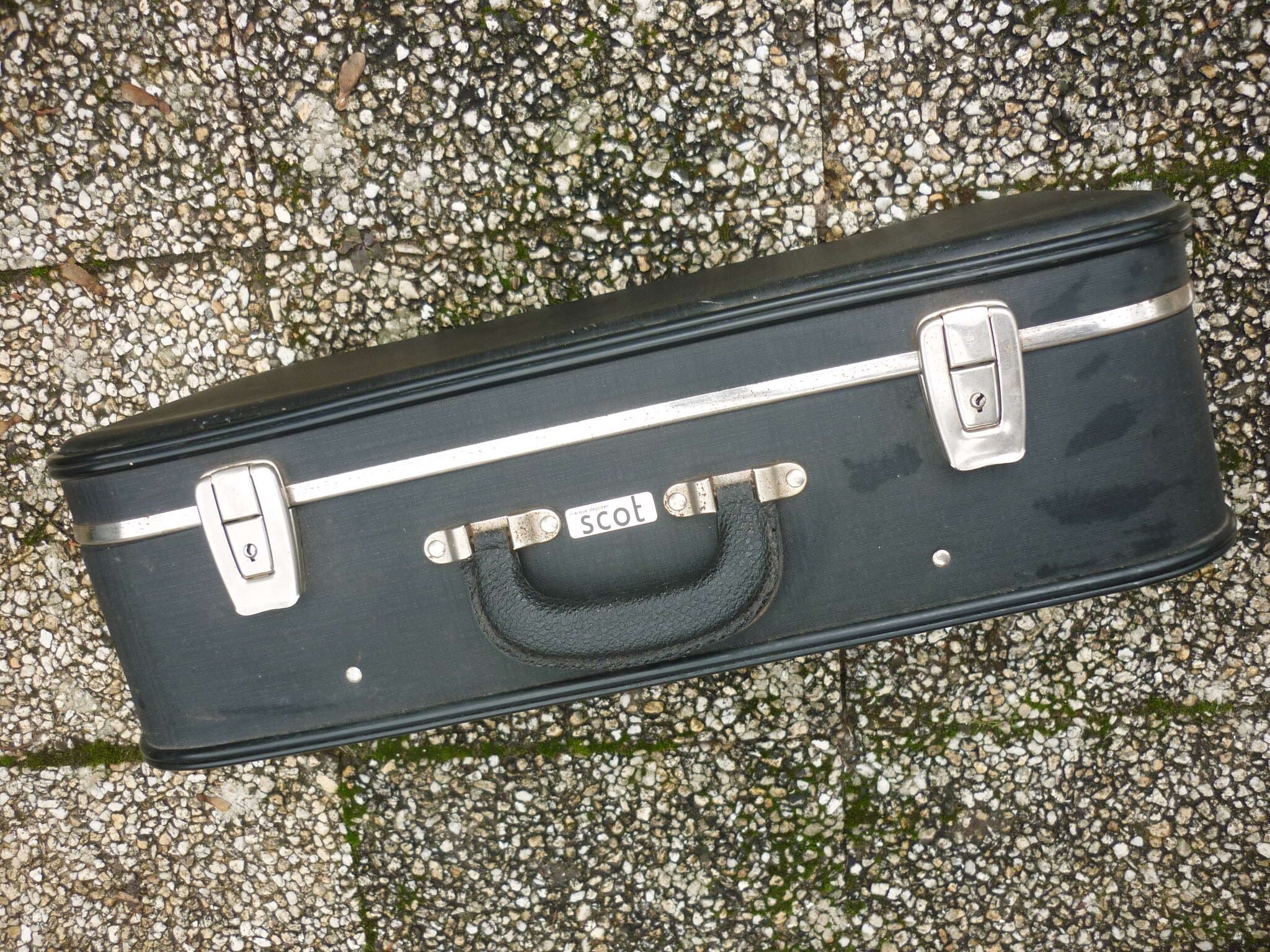 Black antique suitcase, registered trademark scot