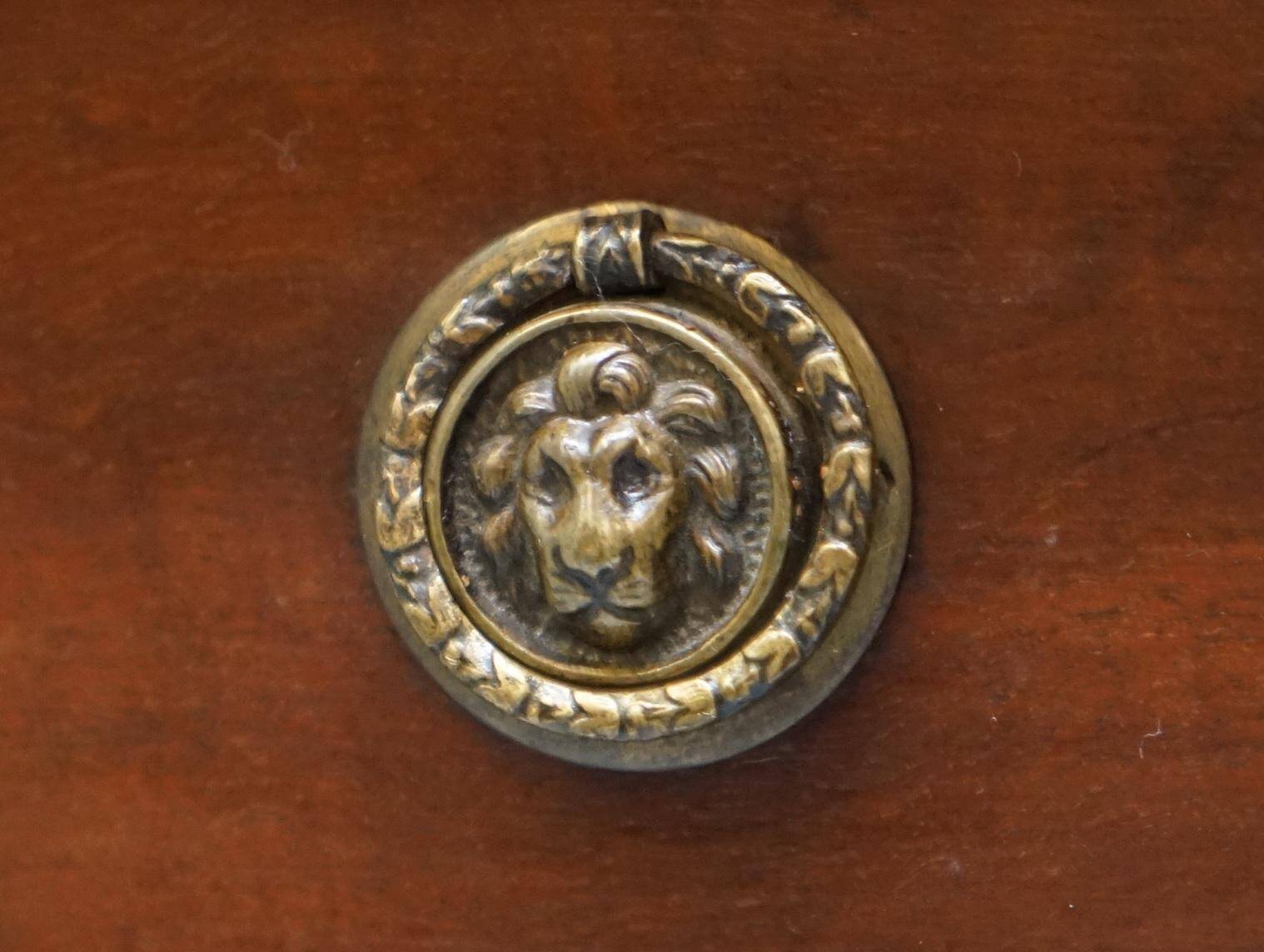 Double-sided partner's desk in walnut, George III, circa 1780, with lion head handles.