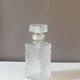 Transparent vintage decanter in chiseled glass and its hermetic cap 70's years