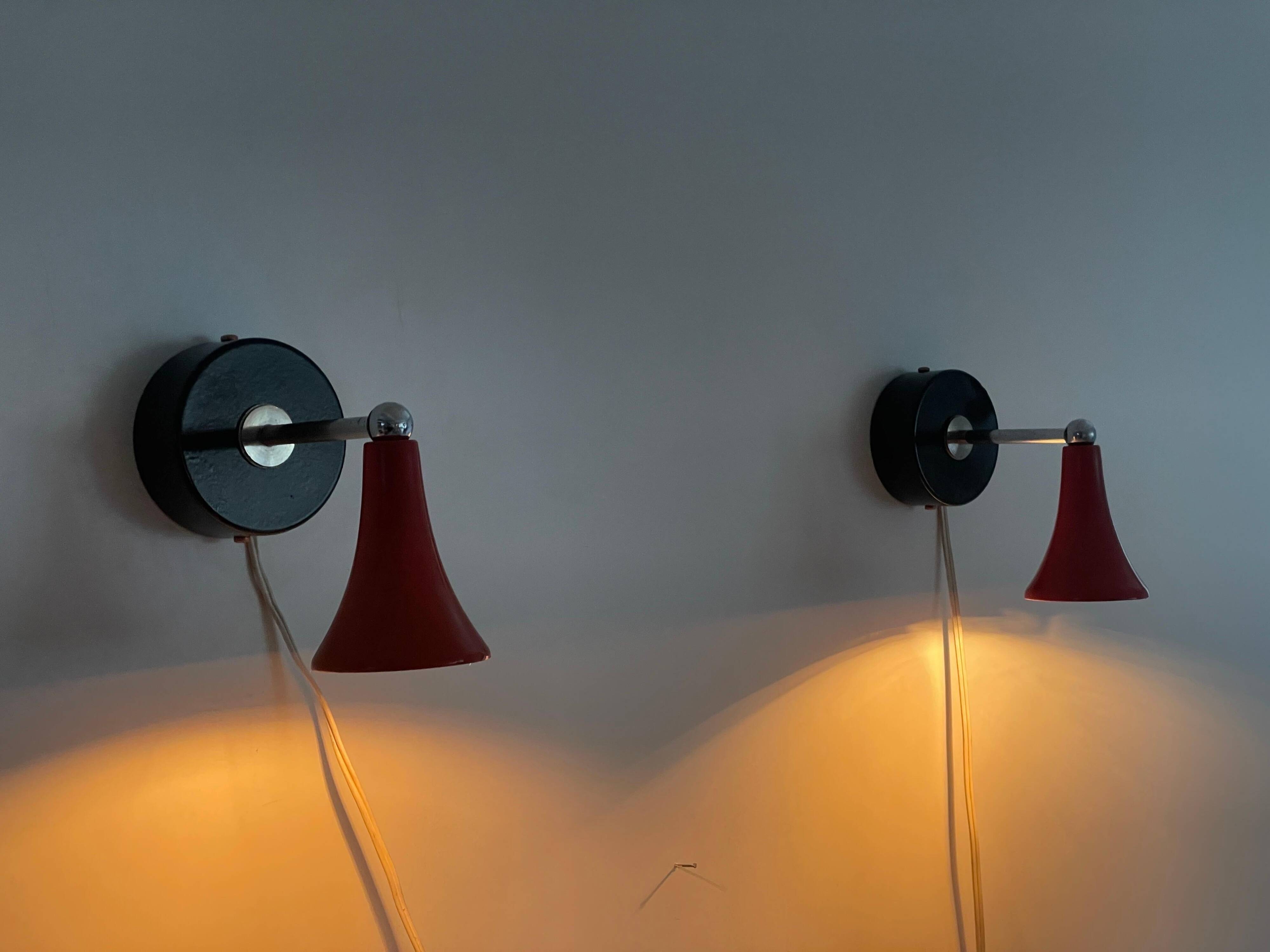 Pair of red metal wall lights AGE, 1970s, Italy