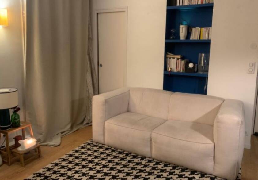 Beige corduroy two-seater sofa