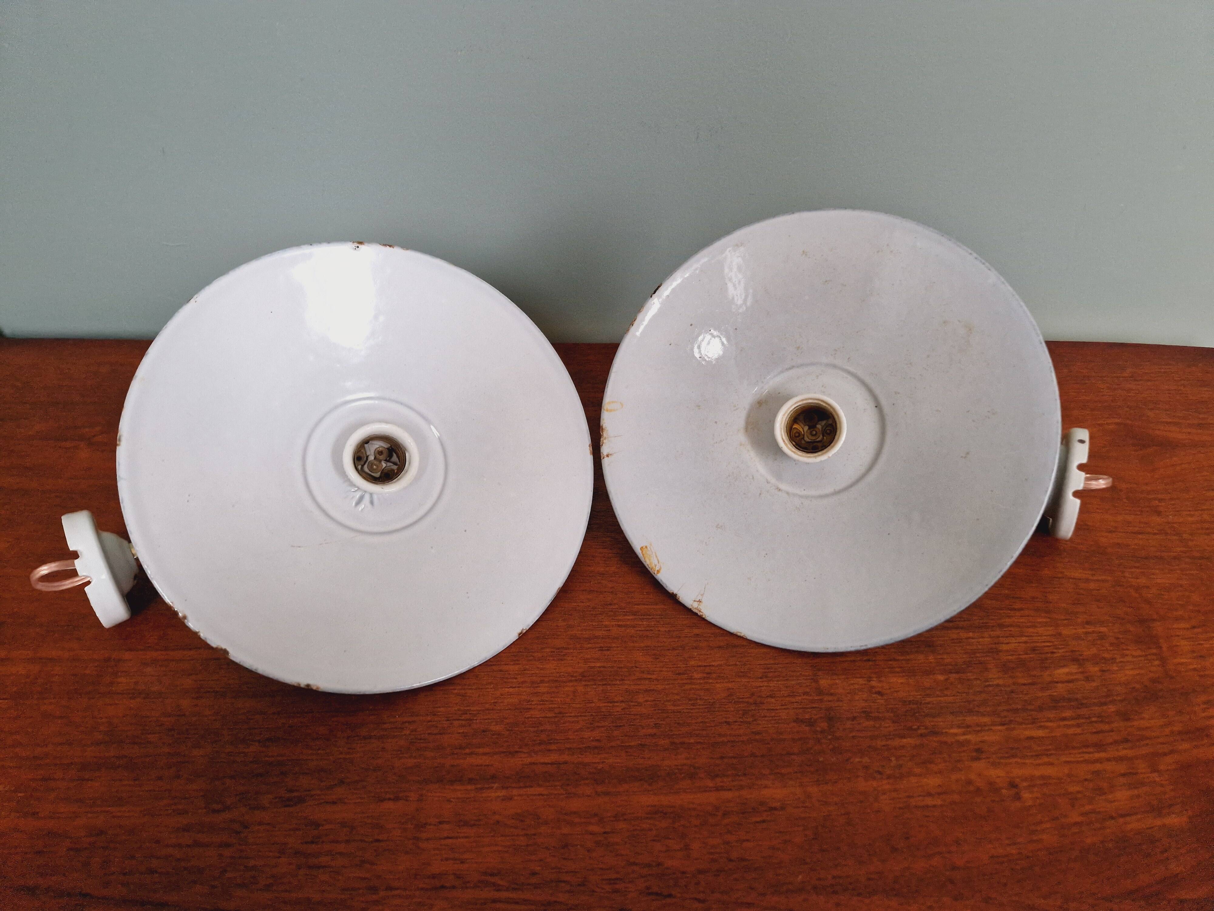 Pair of industrial wall lights in brass and green enameled sheet metal
