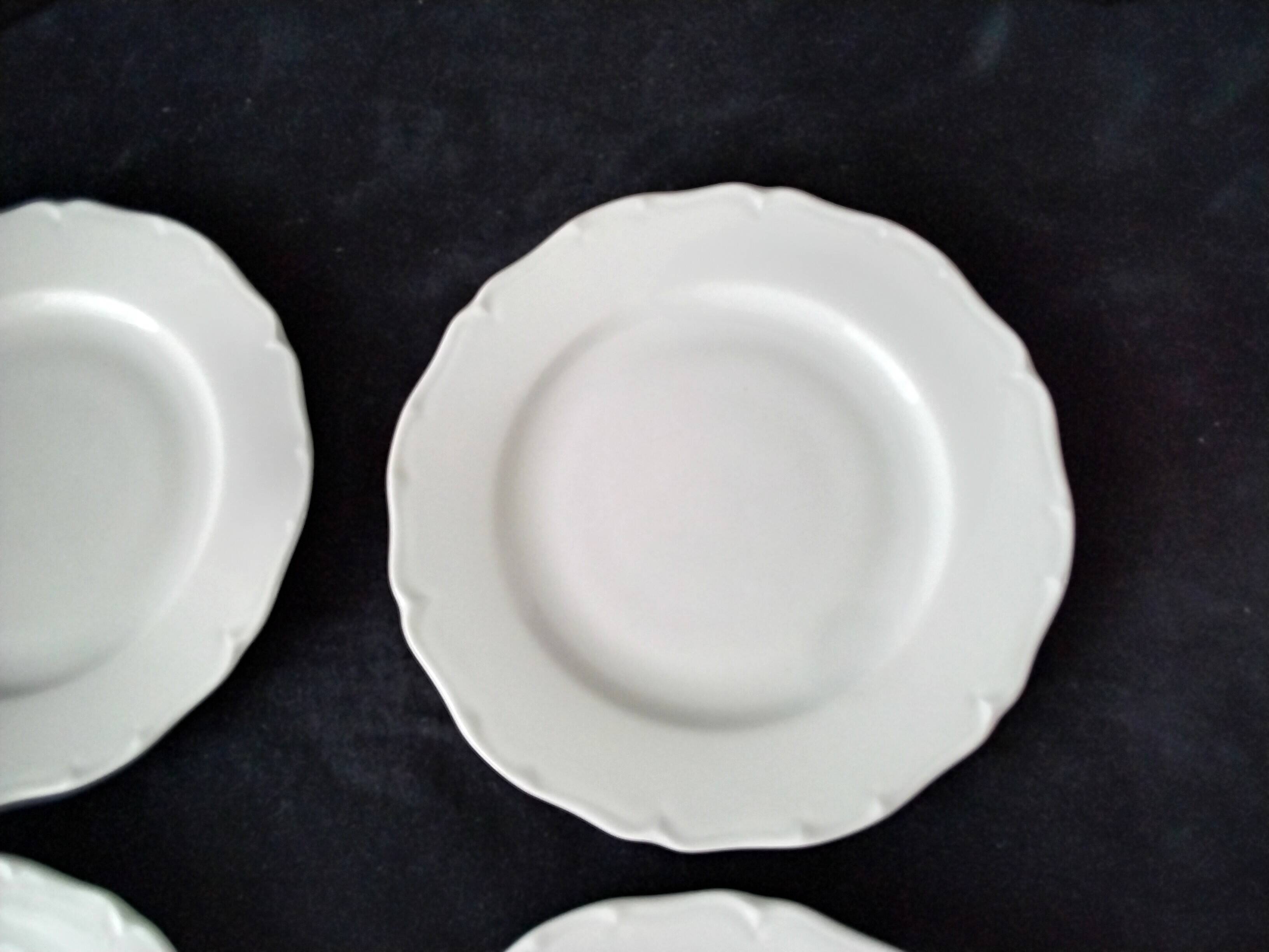 4 white Limoges porcelain dessert plates