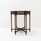 Hexagonal pedestal table or side table with a lattice structure and star pattern.