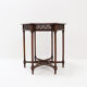 Hexagonal pedestal table or side table with a lattice structure and star pattern.