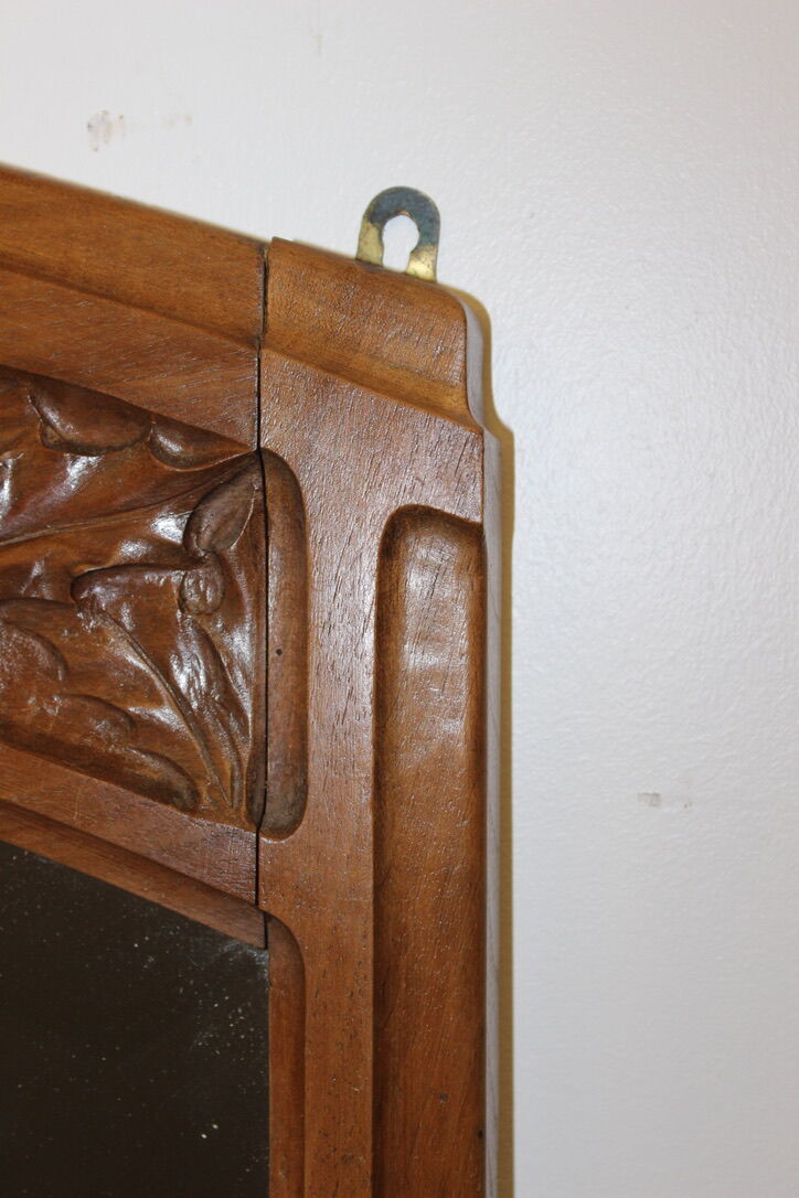 Art Nouveau walnut mirror decorated with holly leaves circa 1900 105x171cm