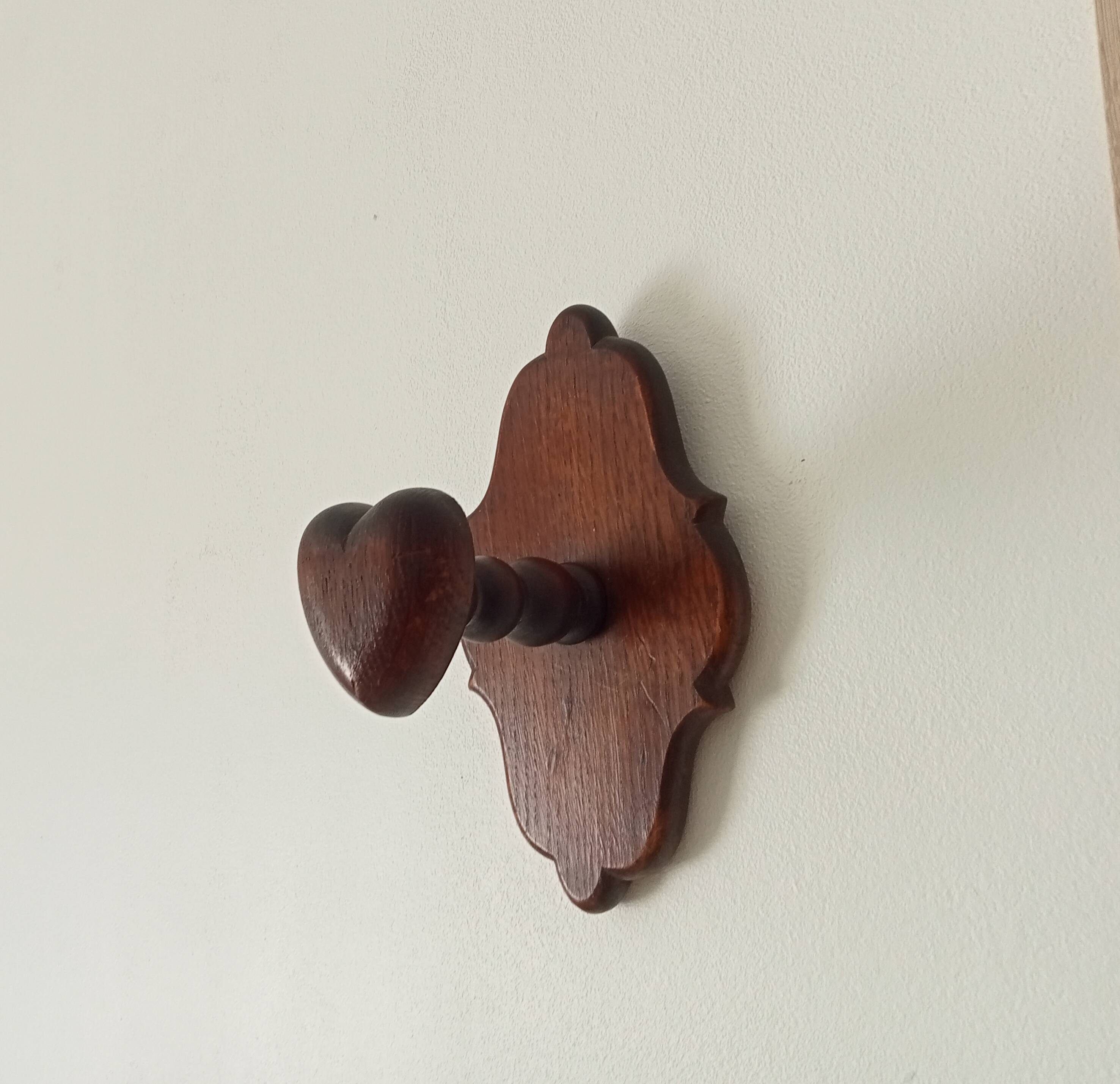 Vintage wall coat rack in carved solid wood, popular art.