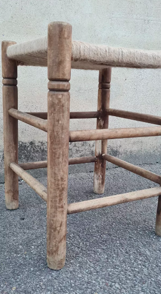 Vintage handmade wooden stool and rope