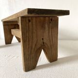 Low stool in raw wood