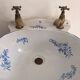 Wall-mounted washbasin shell-shaped, enamelled earthenware by Maurice Herb.
