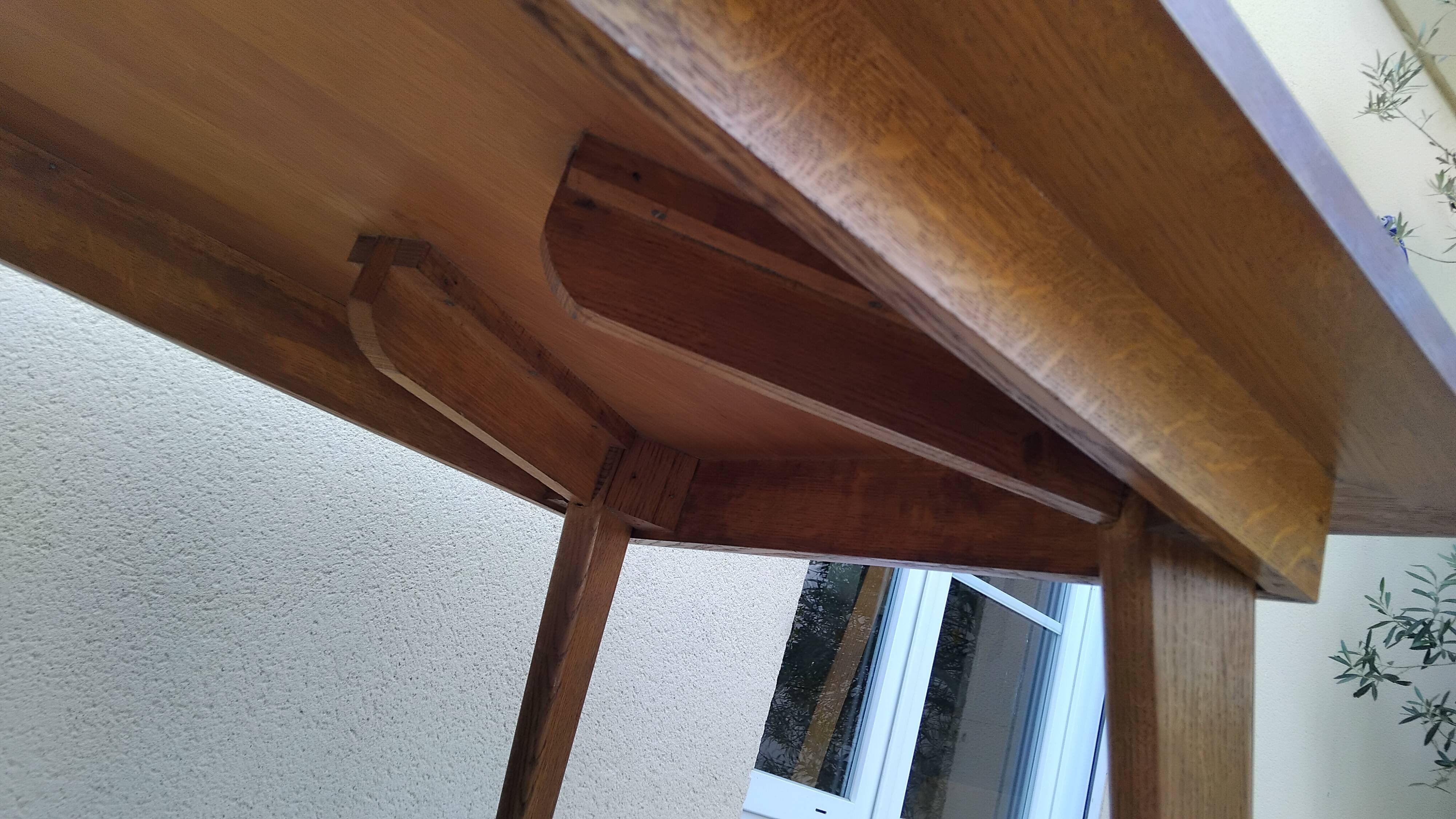 Vintage oak table with tapered legs.