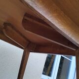 Vintage oak table with tapered legs.