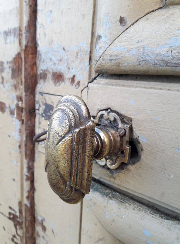19th century double arched entrance door in oak with grilles and old glass