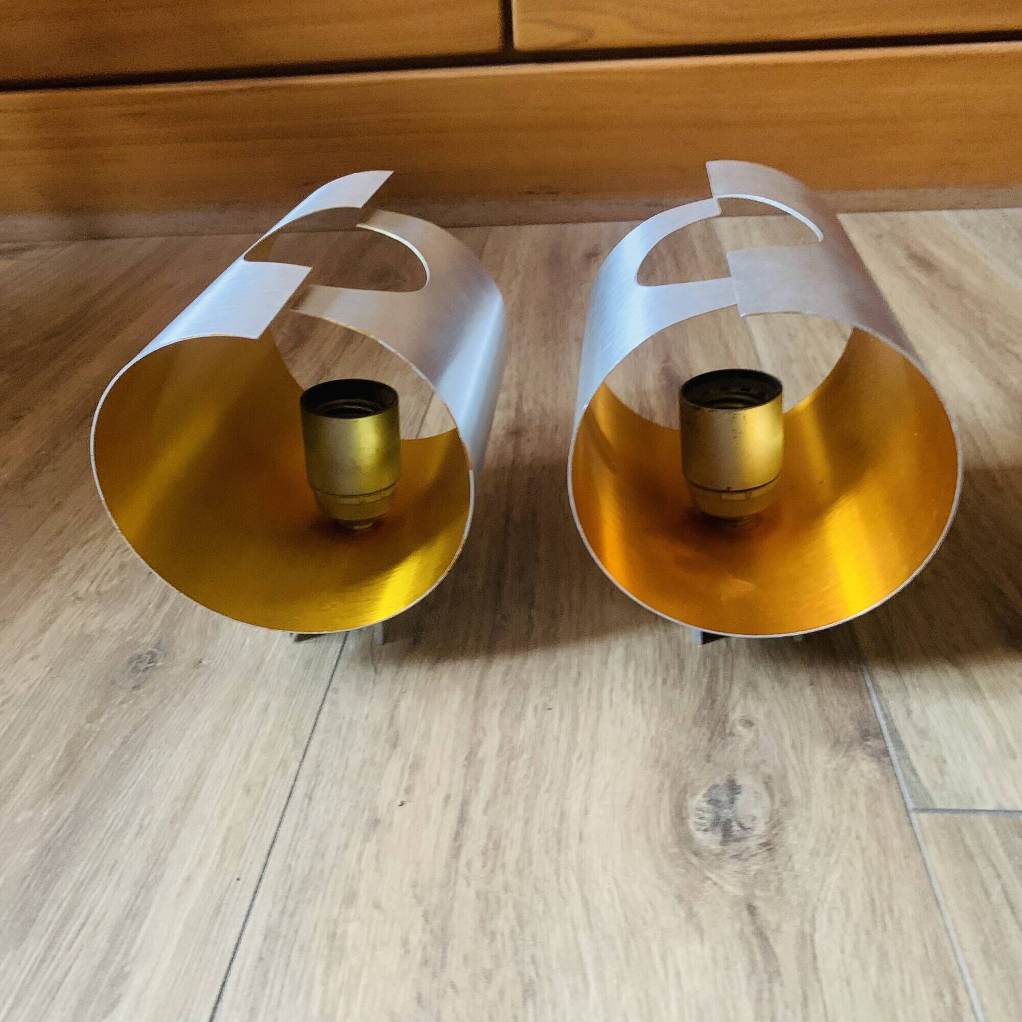 Pair of Space Age wall lights in brushed metal with a copper-orange interior.