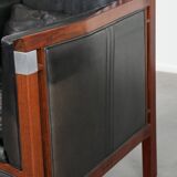 Black cowhide leather and wooden Art Deco design armchair