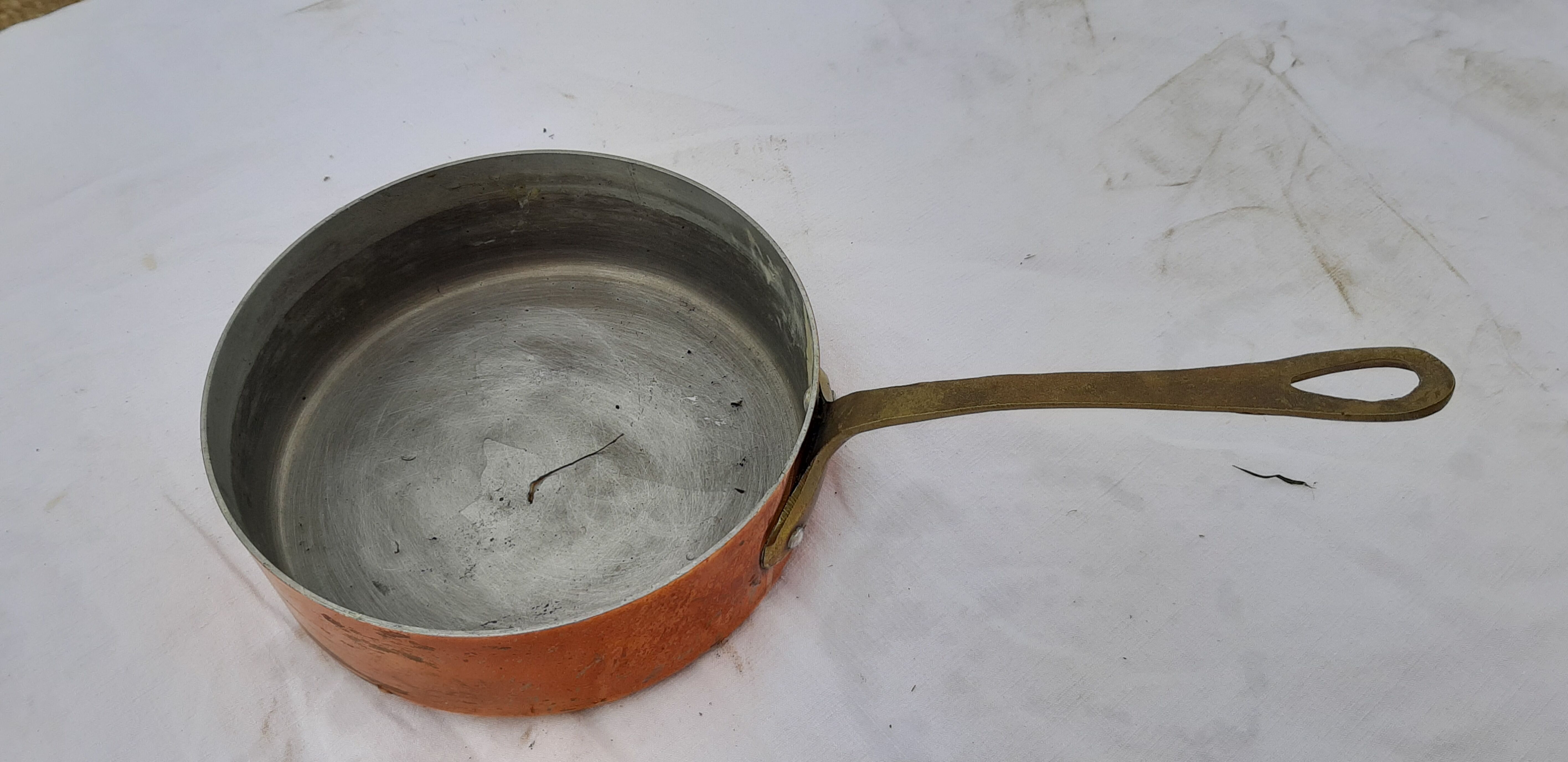 Lots of tinned copper kitchen utensils