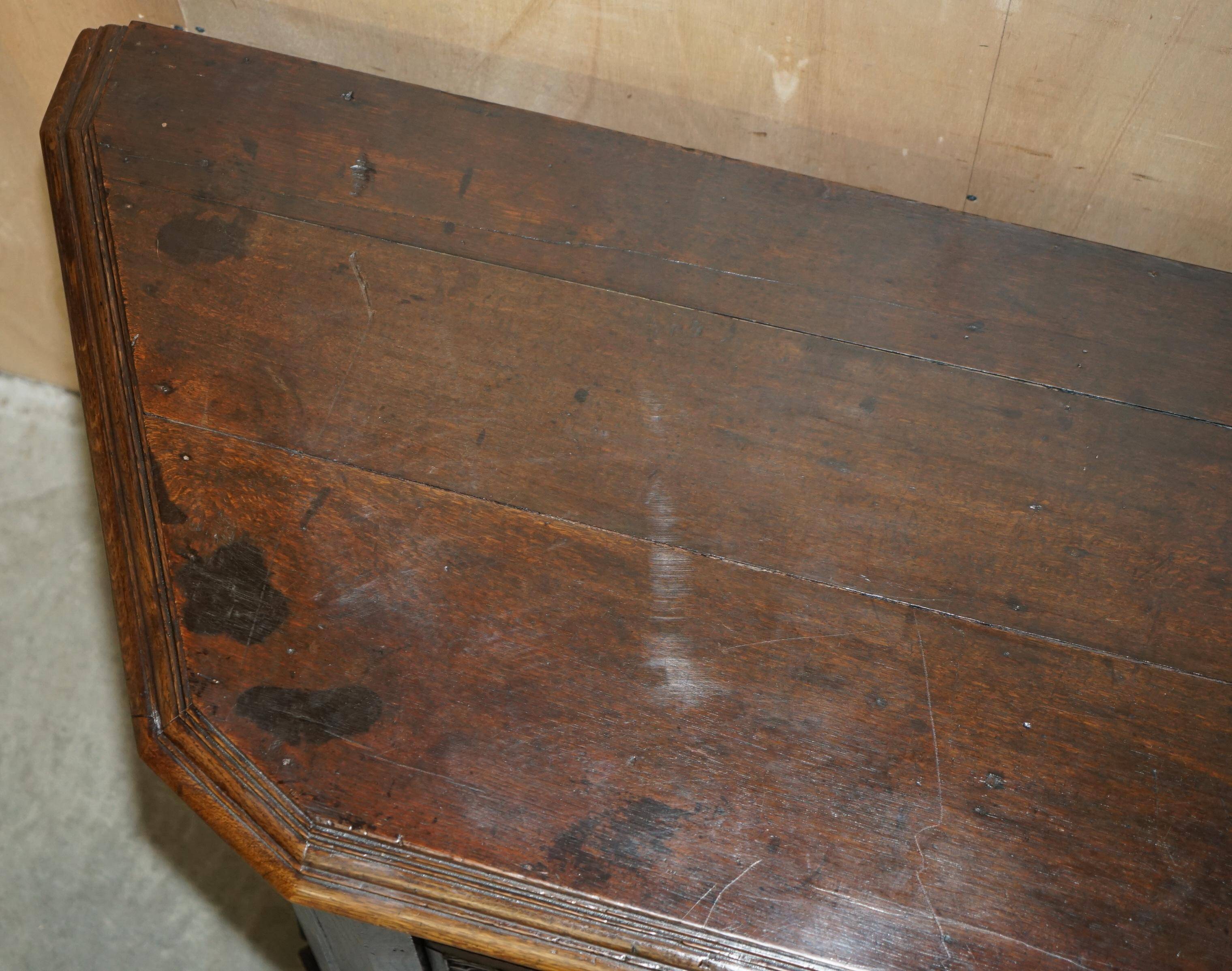 Hand-carved commode from 1685 with sideboards and side cupboards.