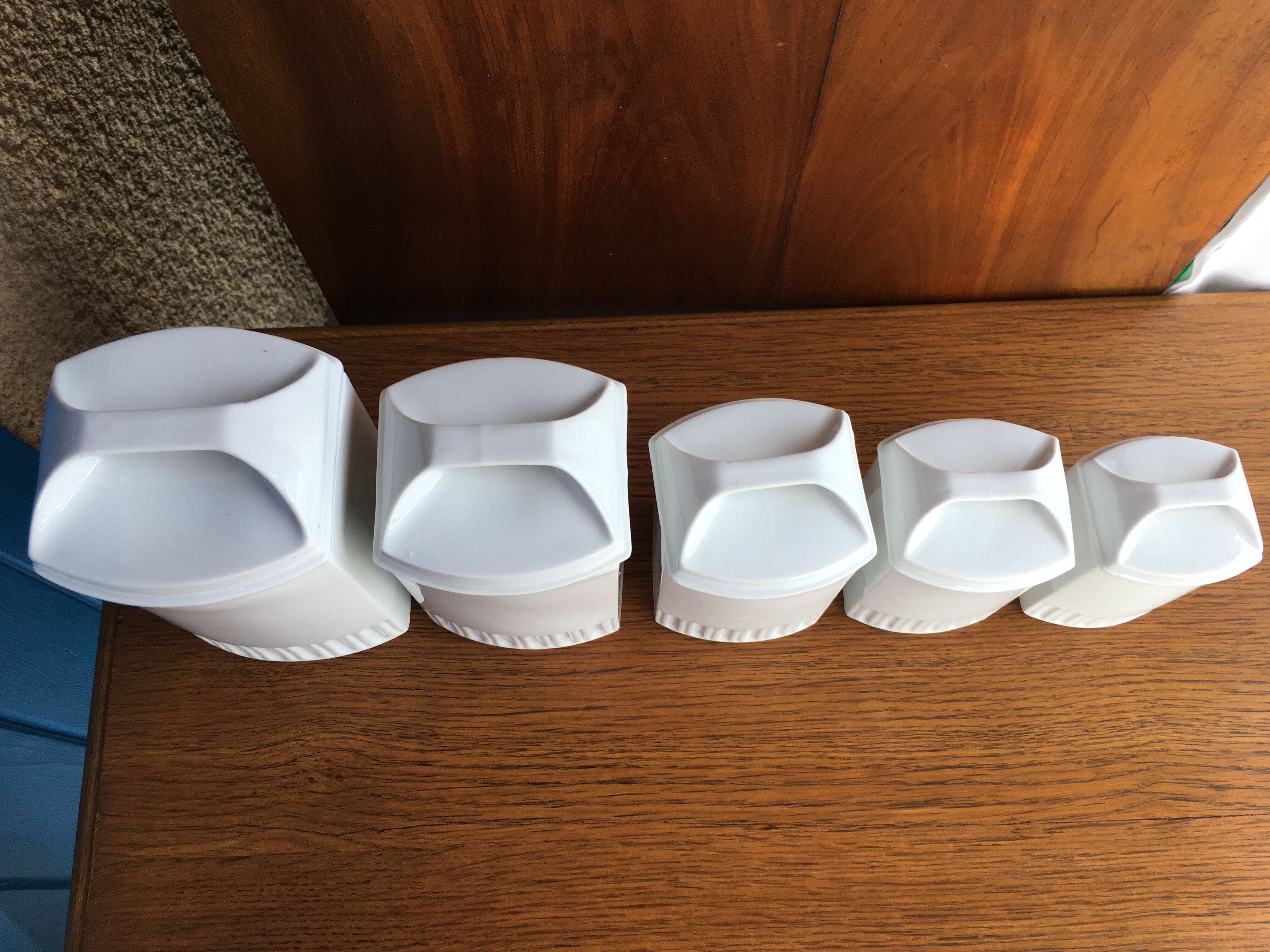 Suite of 5 old porcelain spice pots