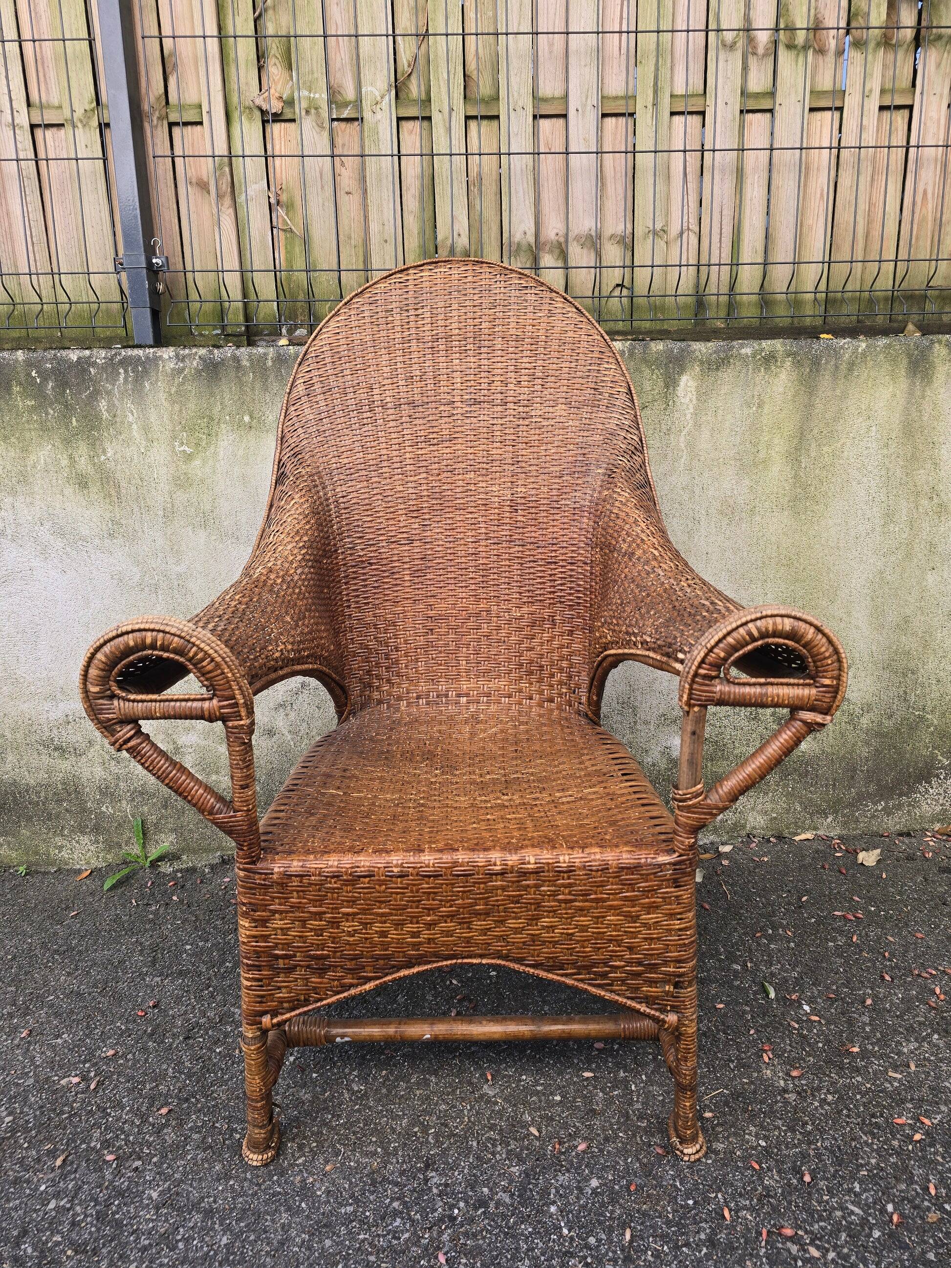 Arts & Crafts armchair in wicker and rattan attributed to Dryad & Co, UK, circa 1920.