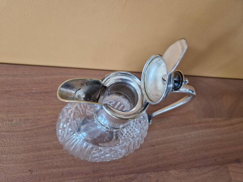 Cut crystal carafe and silver-plated metal